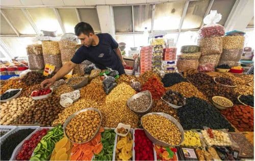 Man Selling Fruit And Nuts In Tashkent Market
